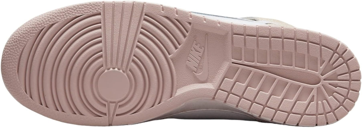 Outsole of white and beige high-top sneakers with tread pattern