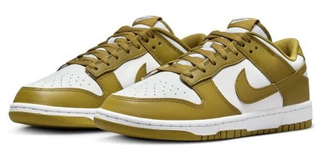 Men's Nike Dunk Low retro sneakers, two-quarter view; white base with mossy green toe and swoosh