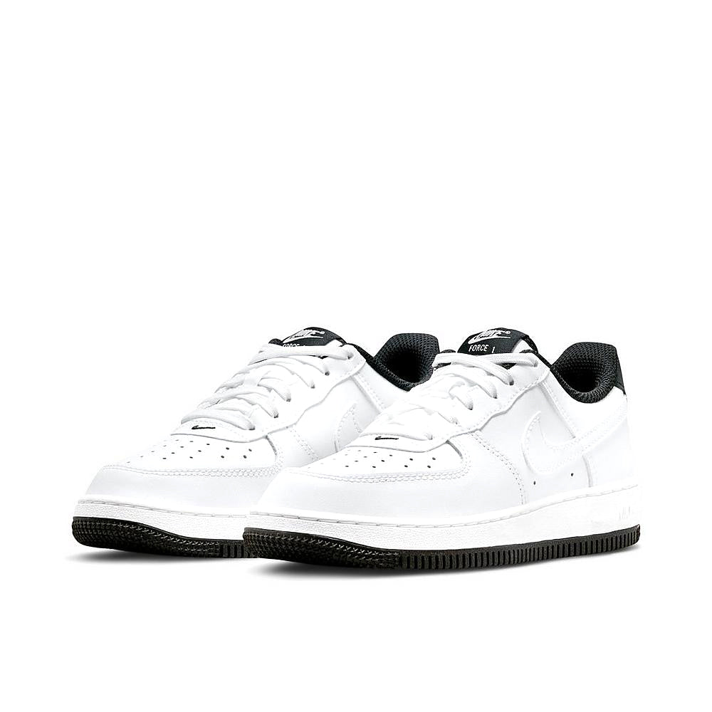 Nike Force 1 kids low-top sneakers, white with black collar accents and textured outsole