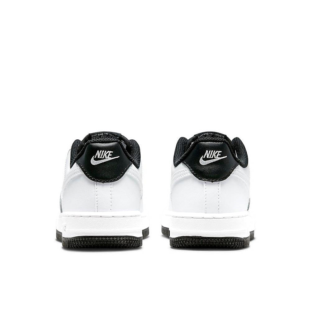 Nike Force 1 kids sneakers, white uppers with black heel padding and Swoosh details