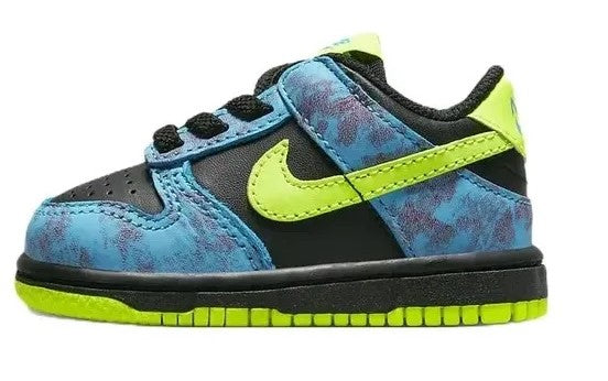 Toddler low-top sneakers with blue patterned upper, neon green swoosh, black sole