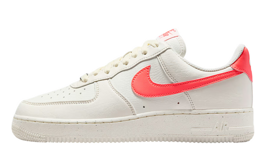 Nike Air Force 1 low-top sneakers in off-white with red swoosh and lace-up