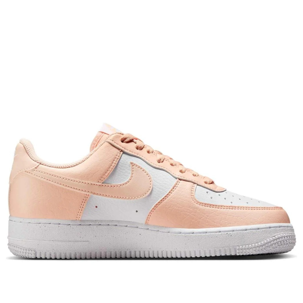 Women's Nike Air Force 1 sneakers, pale peach with white laces and light blue swoosh