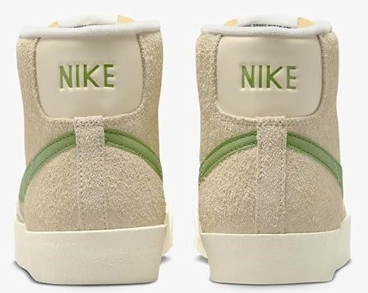 Women’s Nike mid-top sneakers with green Swoosh and Nike logo heel panels
