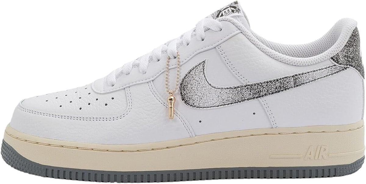 Nike Air Force 1 low-top sneakers, white leather with gray swoosh, gum sole