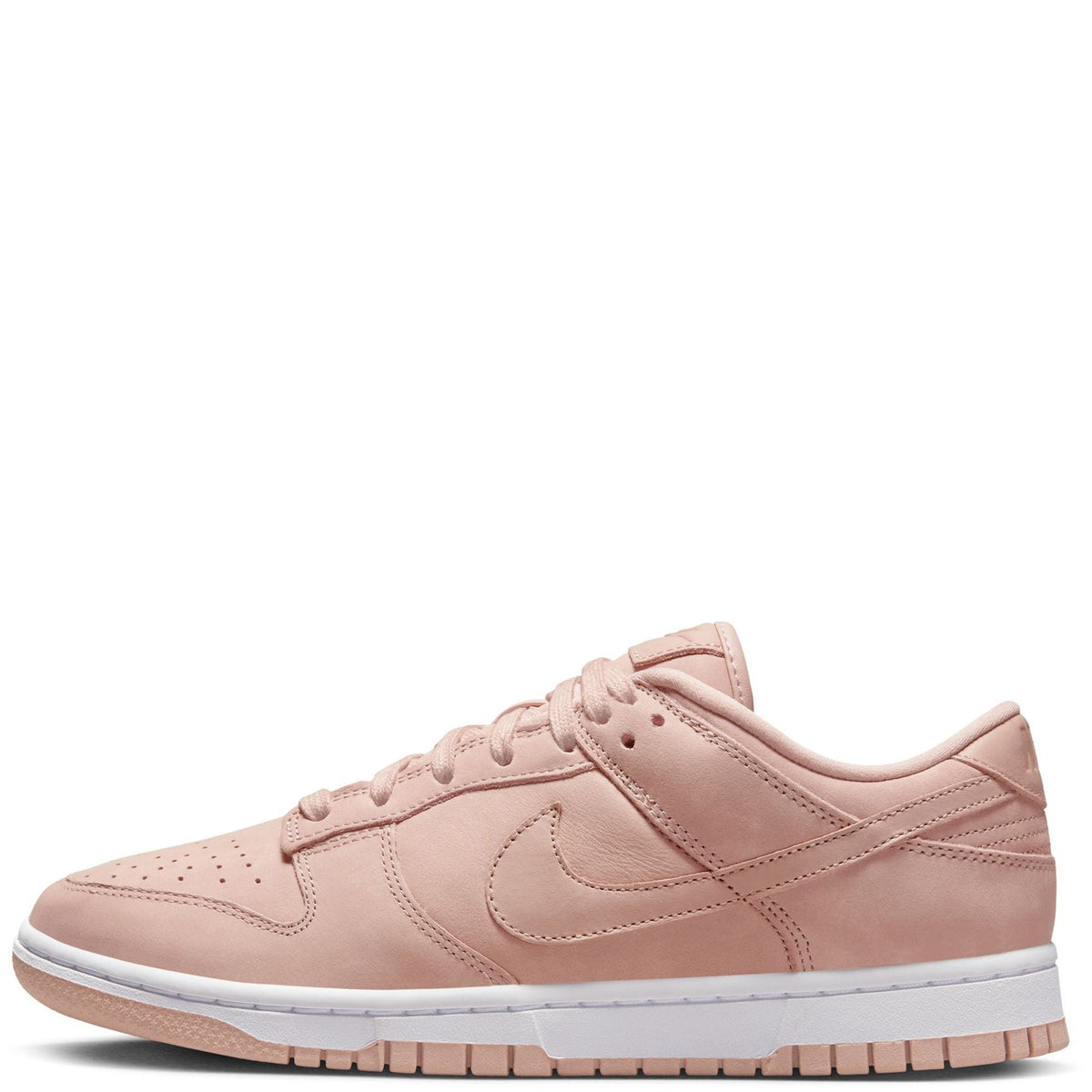 Pink Nike low-top sneakers with Swoosh, lace-up front and white rubber sole
