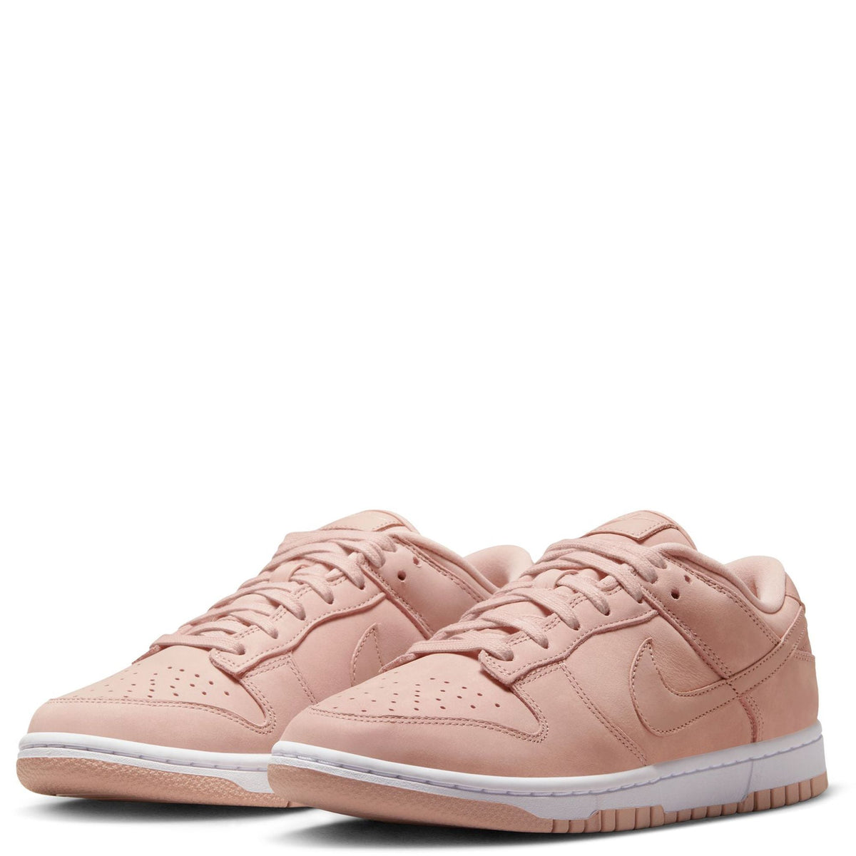 Pink Nike low-top sneakers, two-shoe front view with lace-up and Swoosh