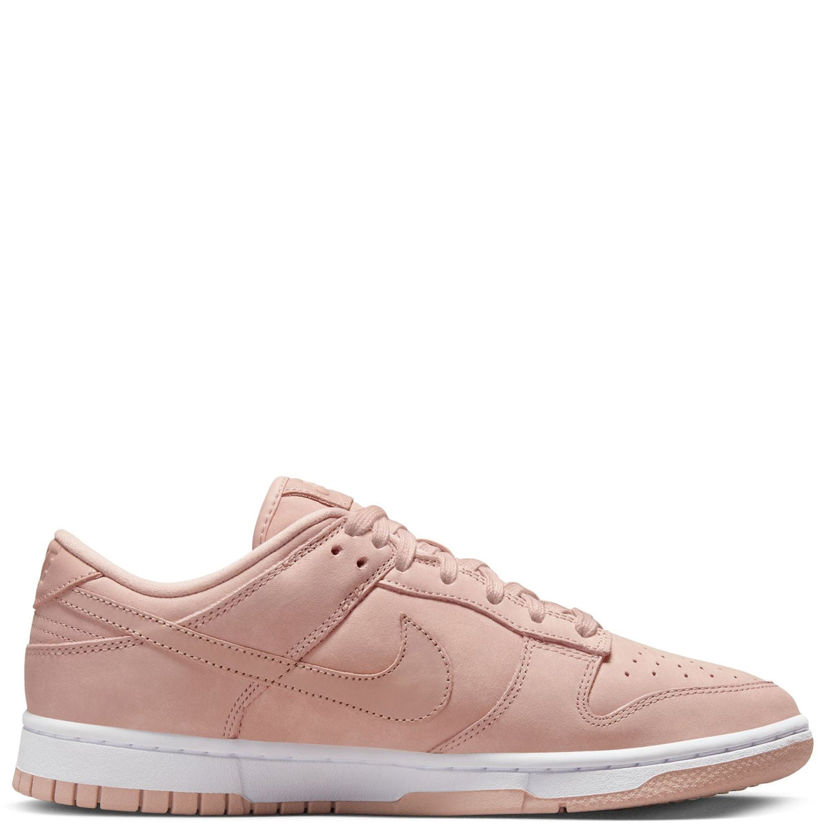 Pink Nike low-top sneakers, side profile with Swoosh and white midsole