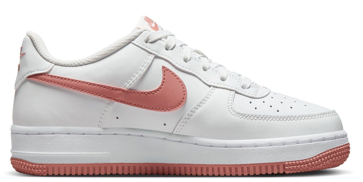 Kids' Nike low-top sneakers in white with red swoosh, perforated toe, lace-up