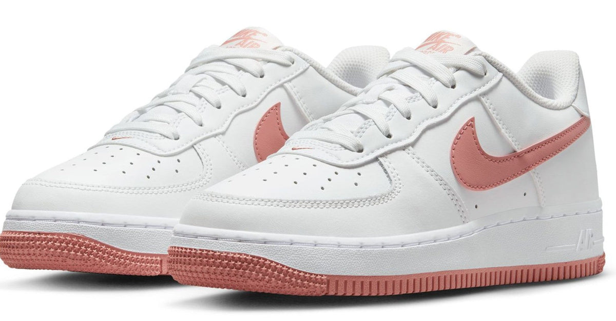 Kids' Nike low-top sneakers, white uppers with red swooshes and pink rubber sole