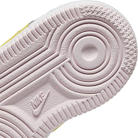 Nike toddler sneaker outsole with circular traction pattern and grey textured tread