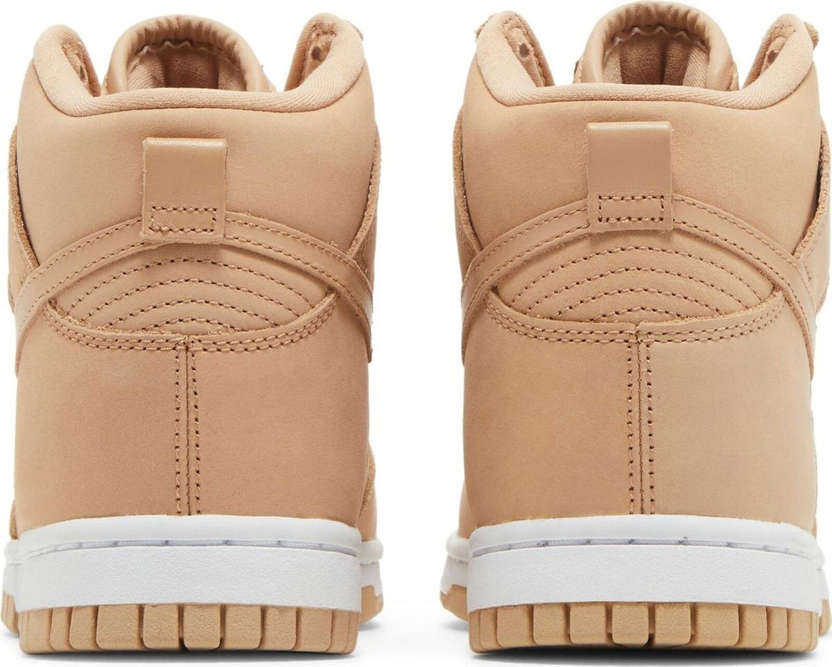 Women's tan Nike Dunk high-top sneakers, rear view with padded heel and lace loops