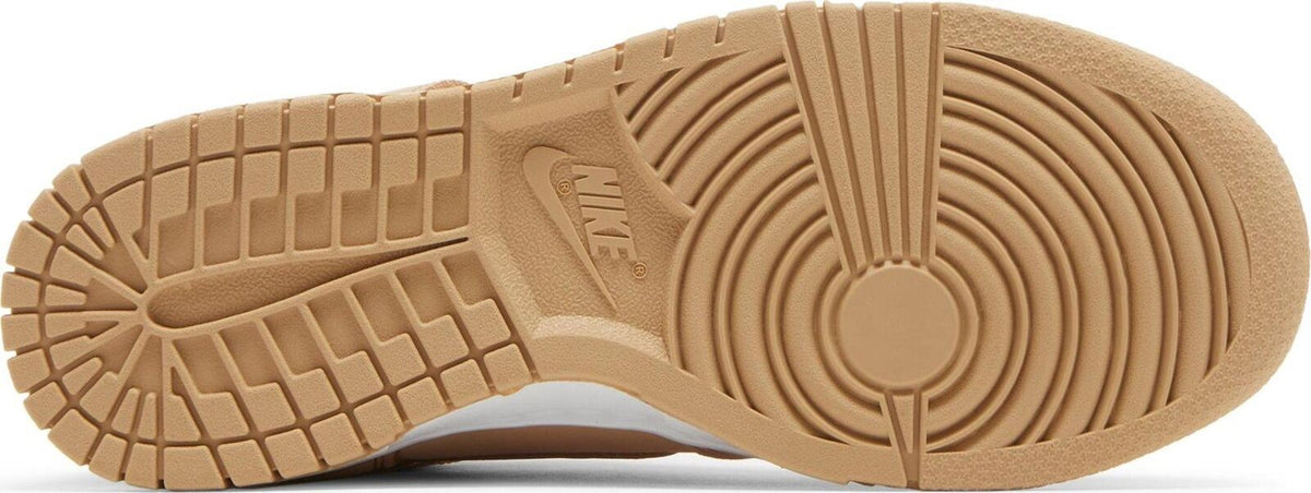 Tan outsole for women's Nike Dunk high-top sneakers with tread and circular pivot pattern