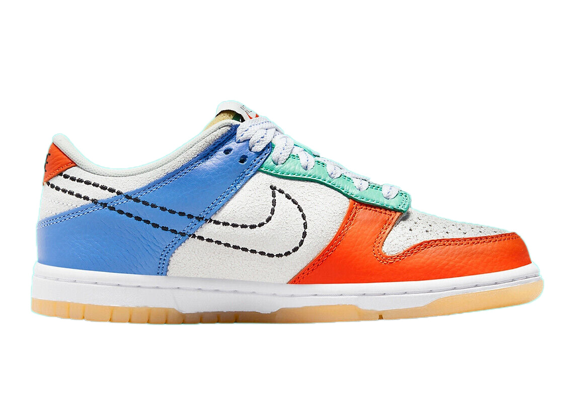 Kids low-top sneakers side view with blue overlays, orange toe, green laces, and white Swoosh