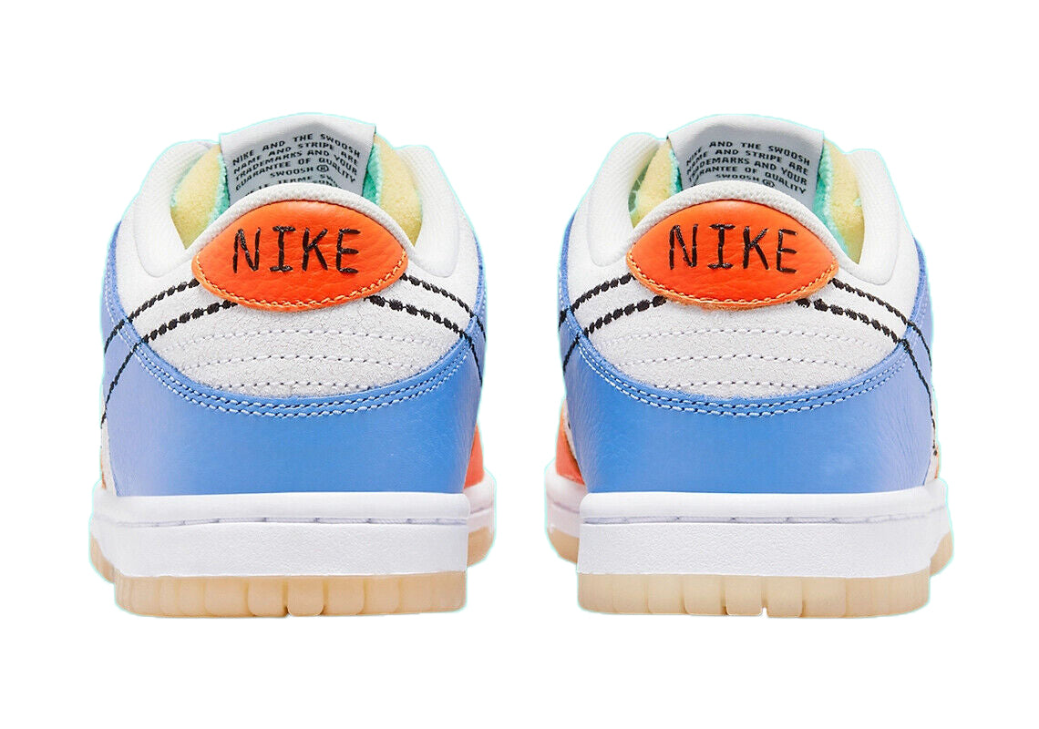 Kids low-top sneakers heel view with Nike logo patch in orange on white and blue leather