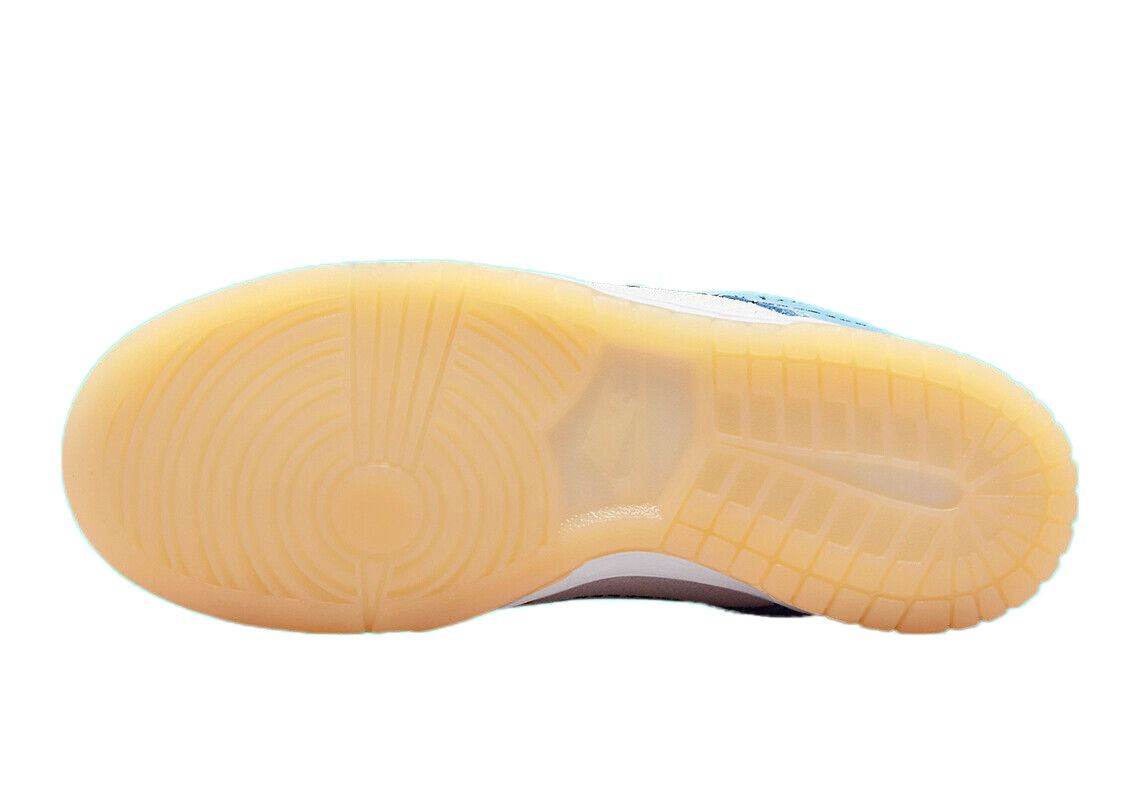 Kids low-top sneaker outsole with tan rubber tread and white midsole underfoot