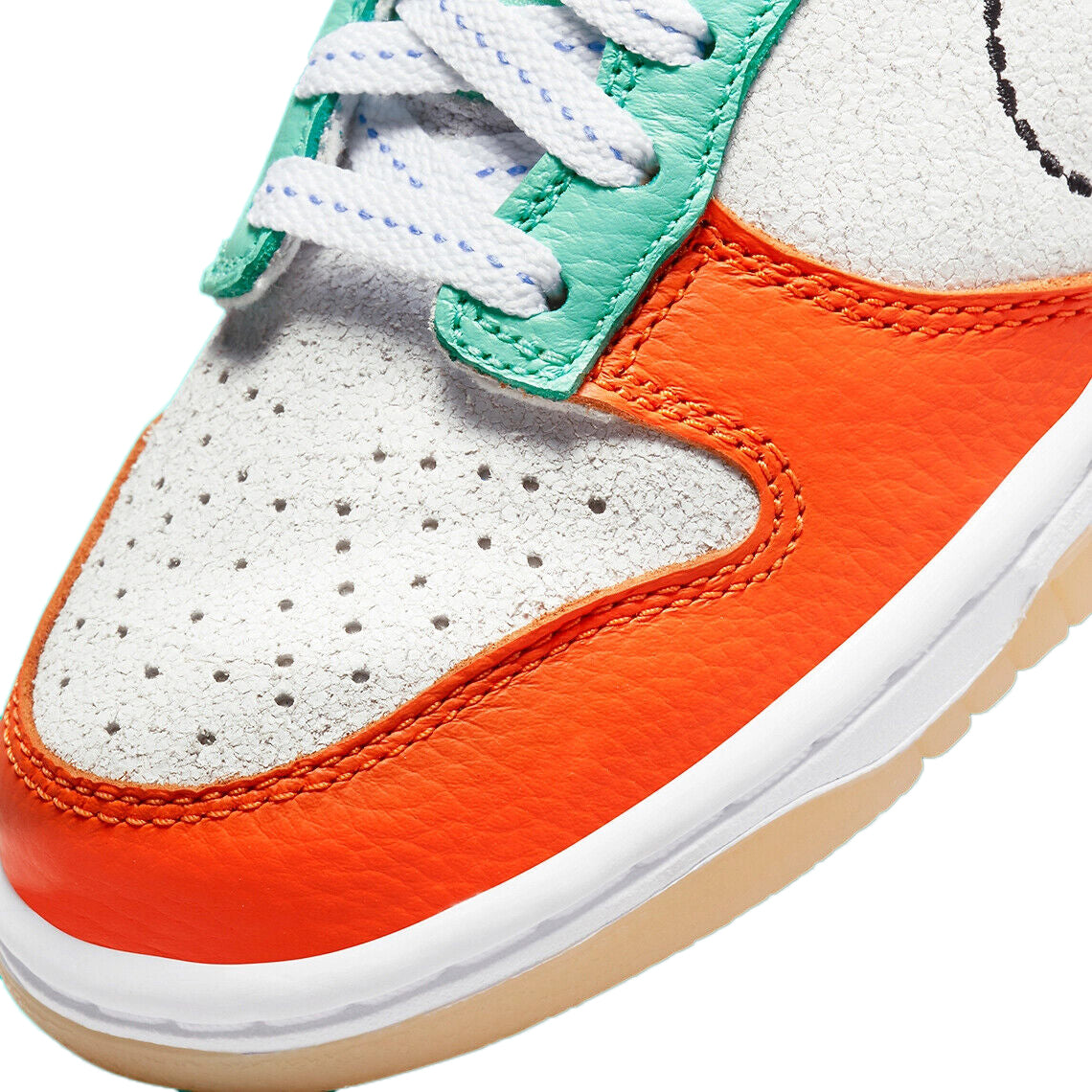 Kids sneaker toe and lace area with perforated white leather, orange overlays, blue trim, green lace