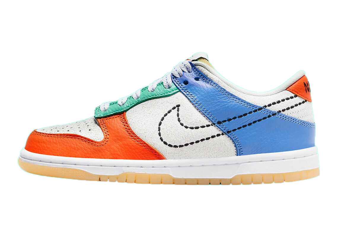 Kids low-top sneakers with white leather upper, blue side panels, orange toe and heel, Swoosh