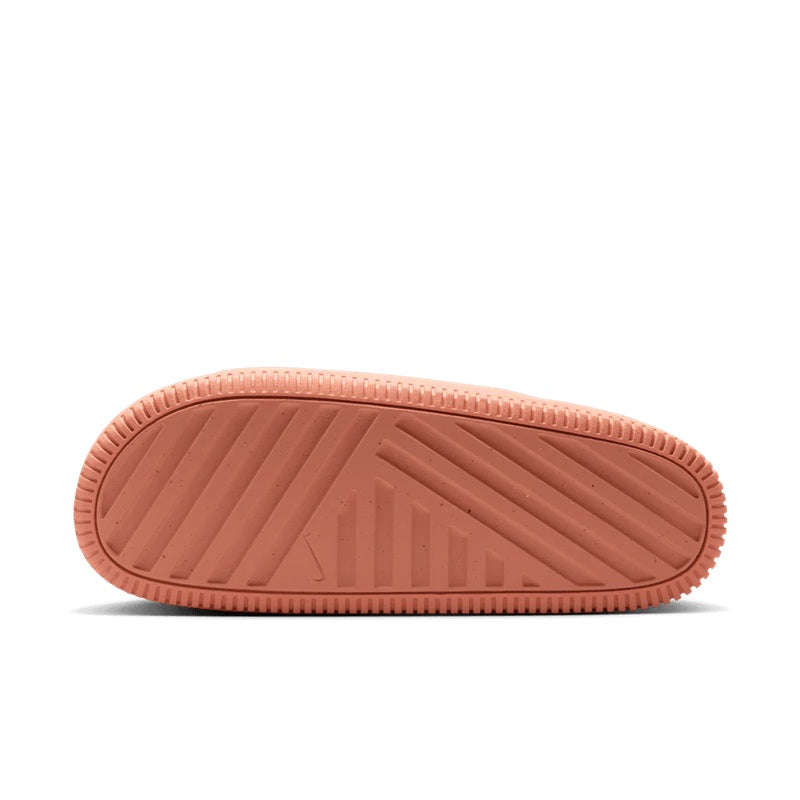 Apricot slide sandals outsole view with textured tread pattern for traction