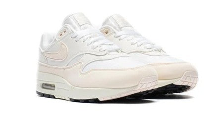 Women's Nike Air Max 1 sneakers, off-white uppers, pinkish accents, lace-up design