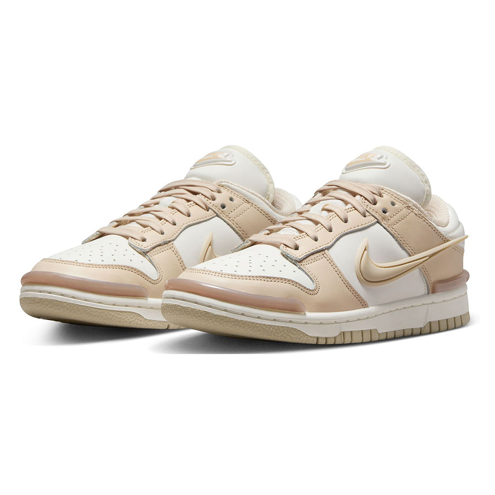 Pair of low-top sneakers in sail and sand tones with gold Swoosh and beige laces