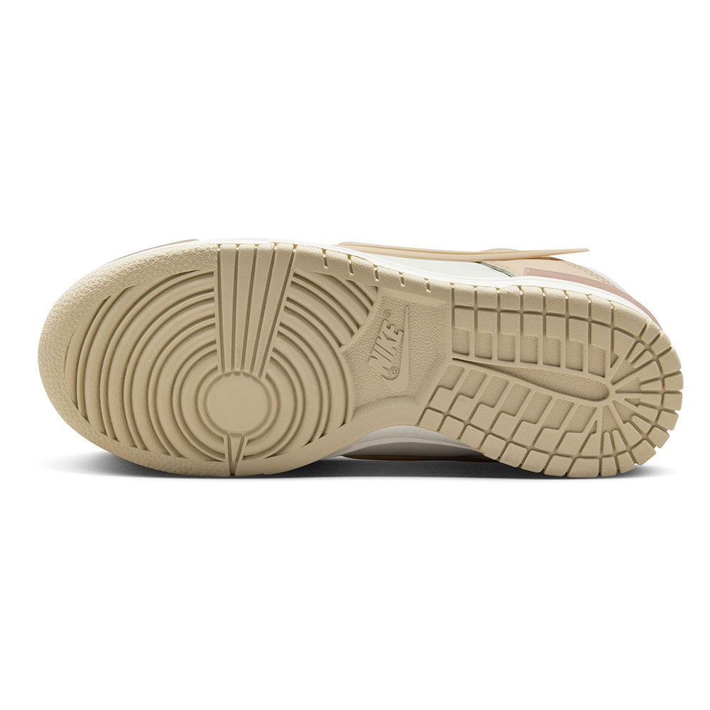 Shoe outsole view for low-top sneakers with textured rubber tread in sand color