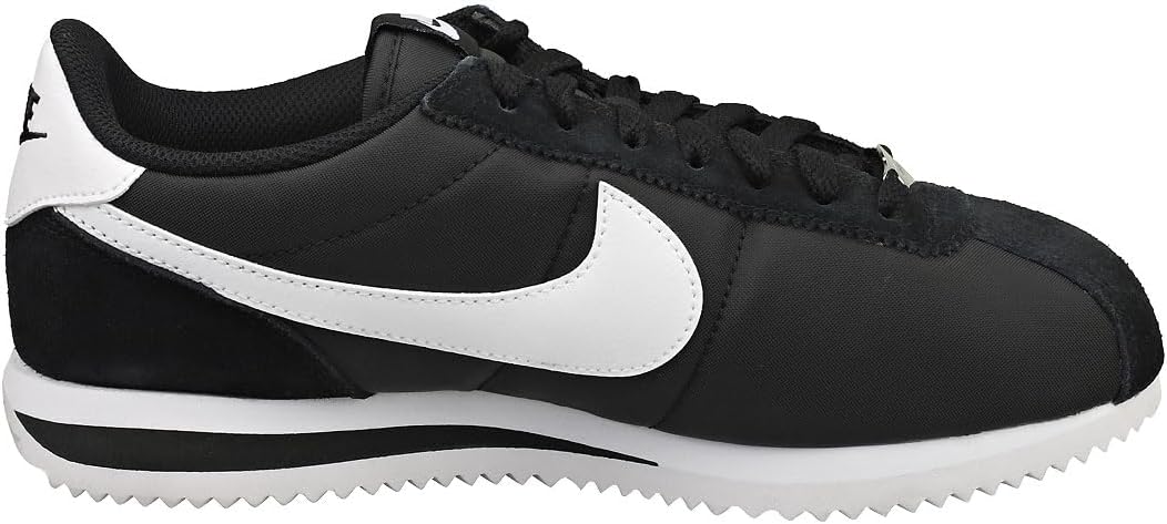 Women's Nike Cortez side profile sneakers, black upper with white swoosh and lace-up