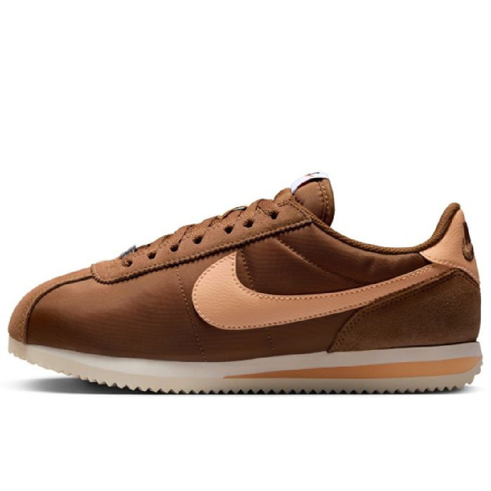 Women's Nike Cortez LT sneakers, brown leather upper with cream swoosh and orange accents.
