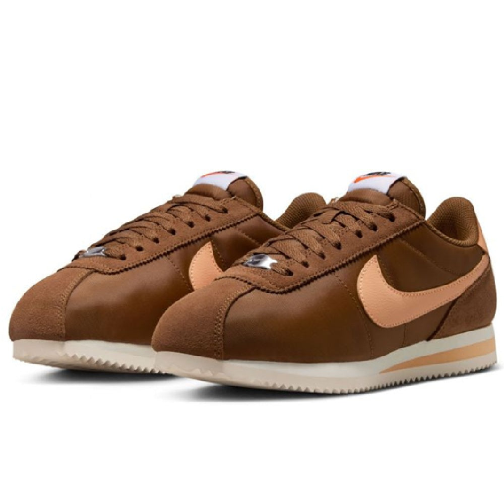 Pair of Women's Nike Cortez LT sneakers, brown suede-look with cream swoosh and laces.
