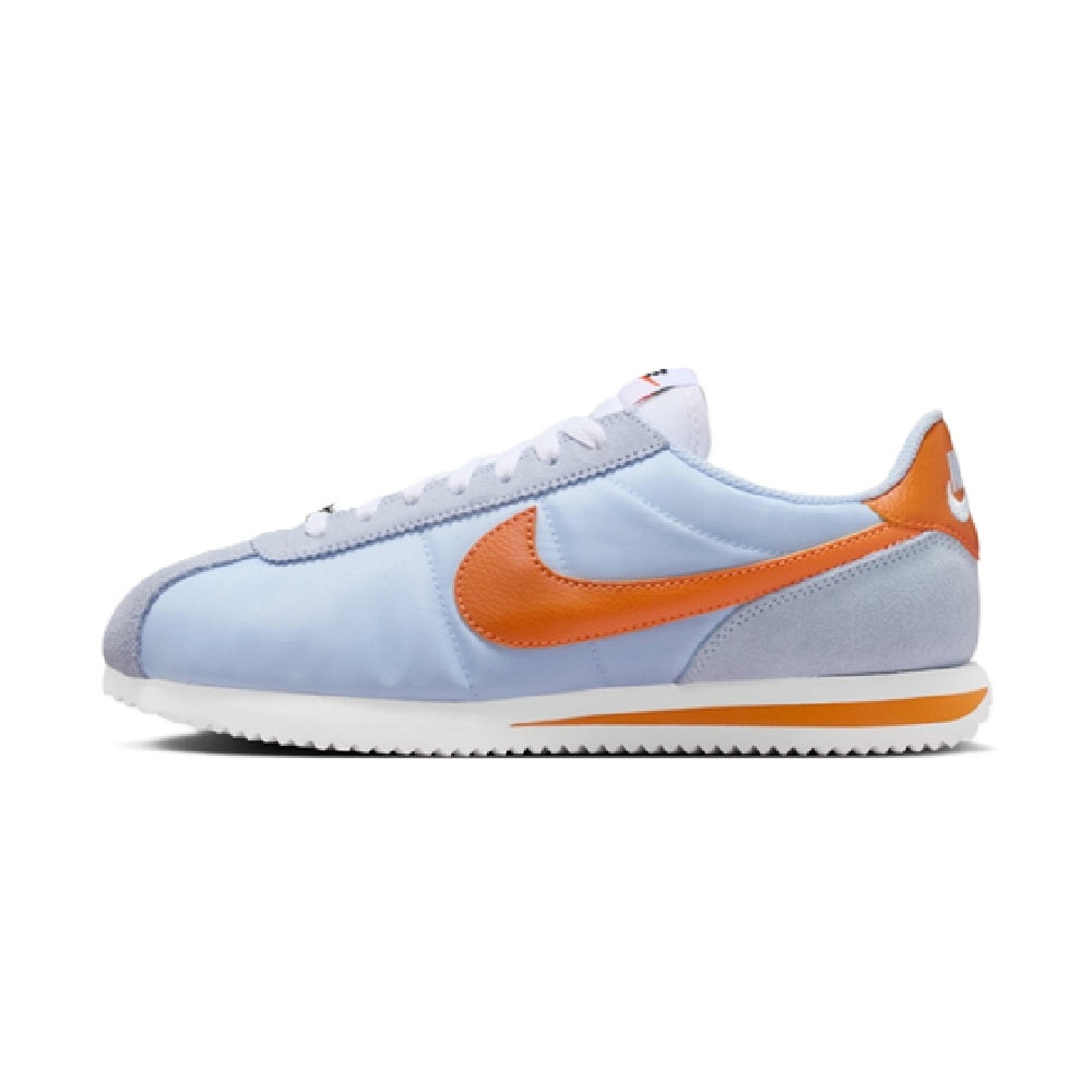 Nike Cortez sneakers, light blue suede with orange Swoosh and white sole