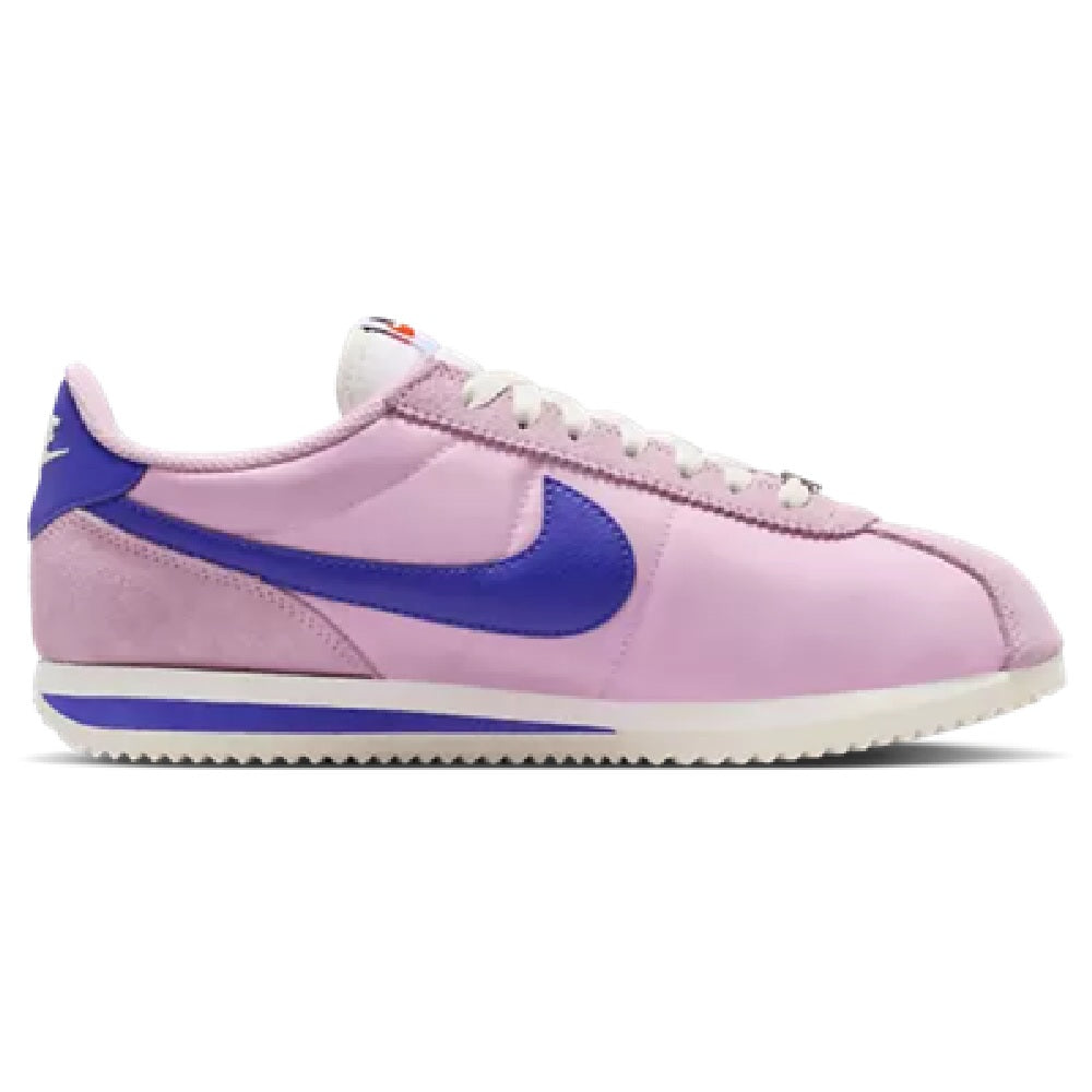 Women's Nike Cortez LT low-top sneakers in pink with blue swoosh and white sole.