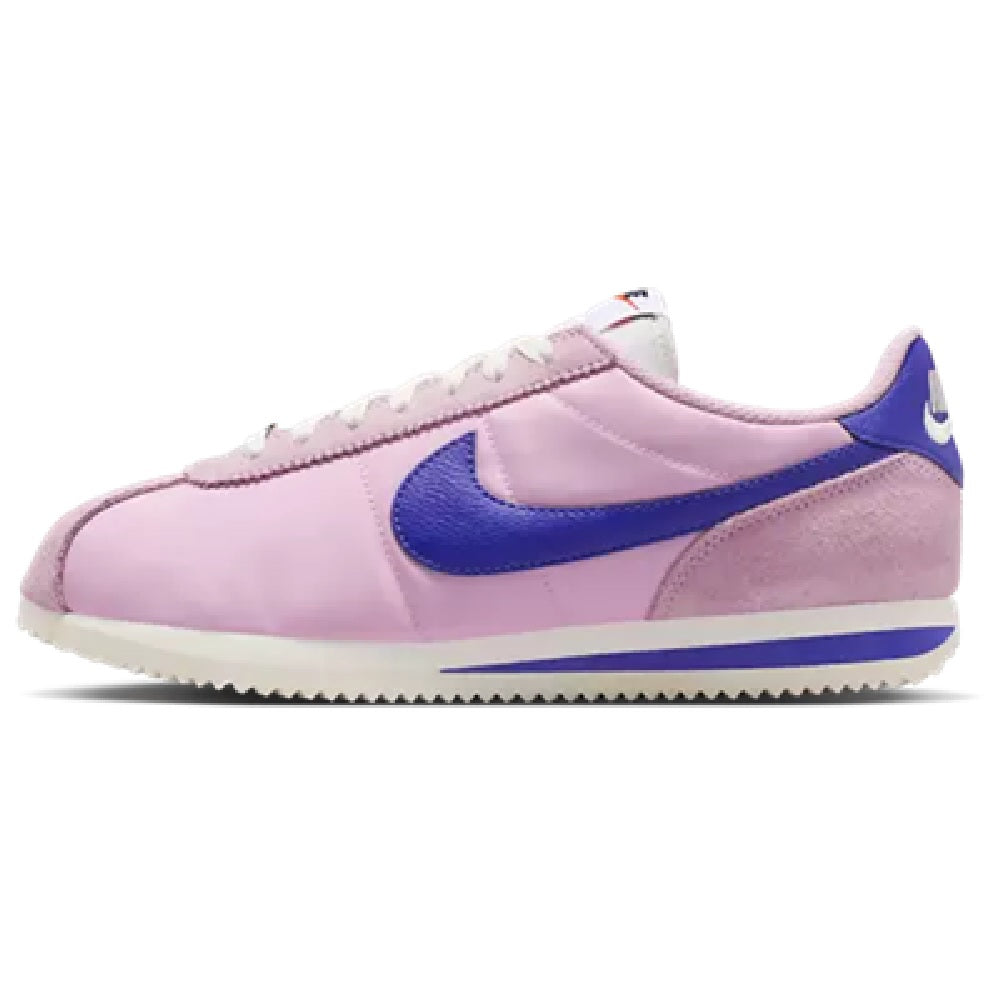 Women's Nike Cortez LT sneakers, pink leather with blue swoosh and lace-up front.