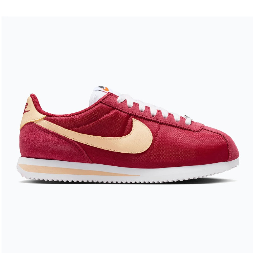 Women's red suede Cortez sneakers with cream swoosh and white laces