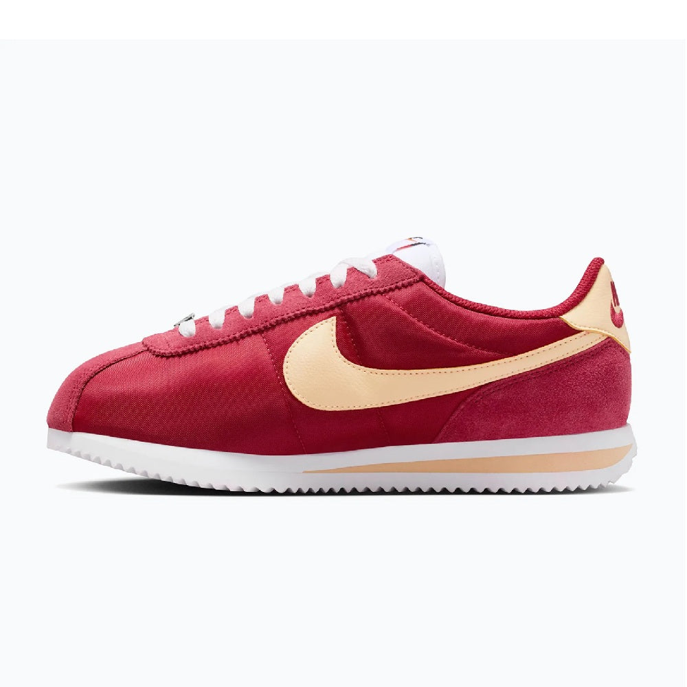 Women's red Cortez low-top sneakers, cream side swoosh, white midsole