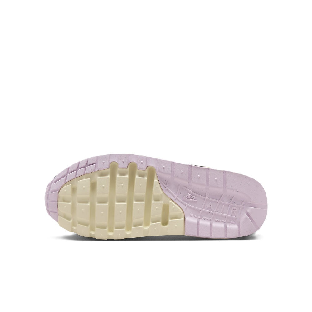 Kids' Nike Air Max 1 sneakers, visible outsole tread in pink and cream.