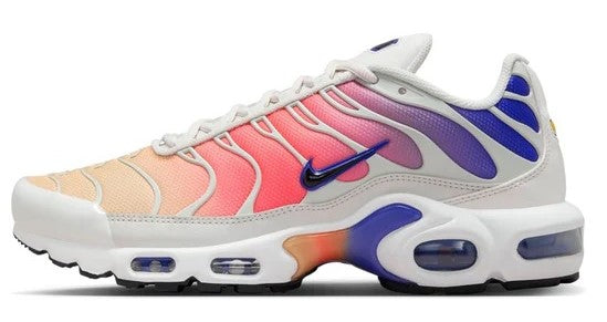 Nike Air Max Plus sneakers, off-white with pink and blue accents, lace-up, visible Air pods.