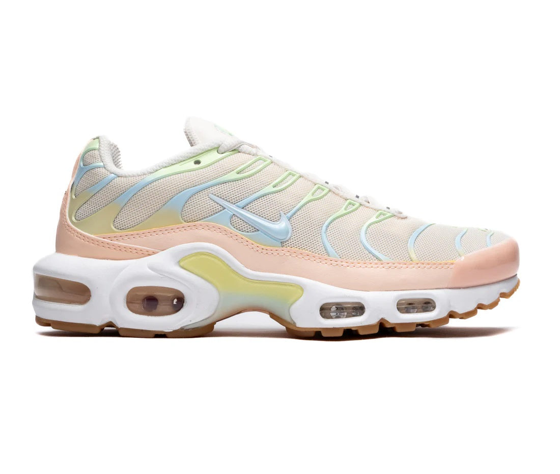 Women's Nike Air Max Plus sneakers in light pink with blue and mint accents, white sole