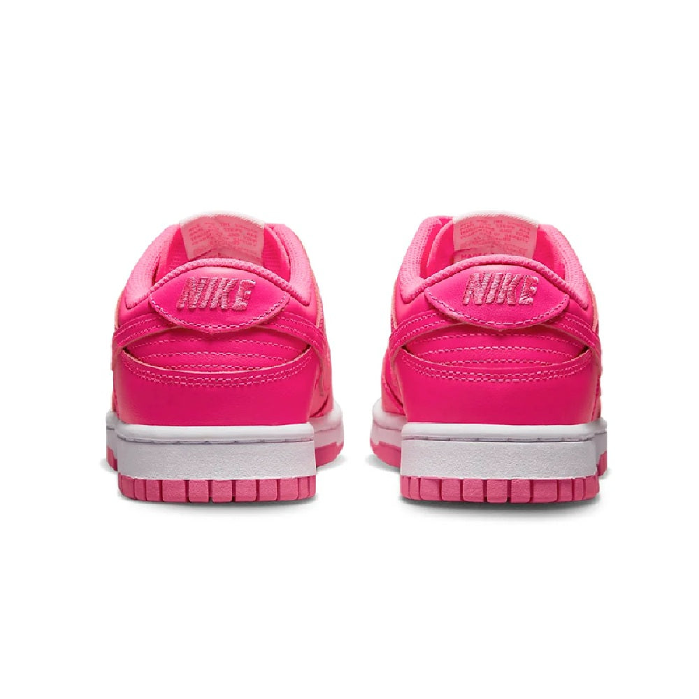 Nike Dunk Low sneakers, back view with pink heel tabs and white midsoles