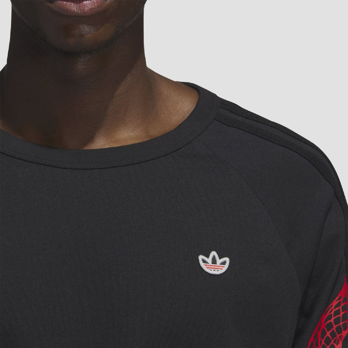 adidas Originals CLOT LNY long sleeve T-shirt featuring bold design and branding, made from comfortable fabric for casual wear