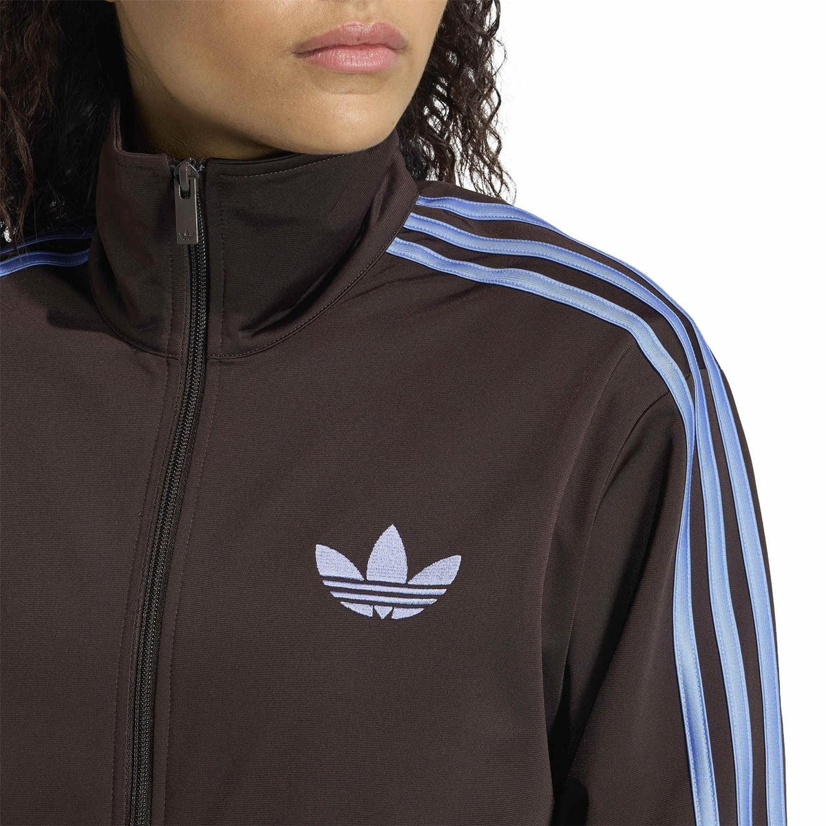 adidas Originals high-neck zip top with trefoil logo and blue striped shoulder panels