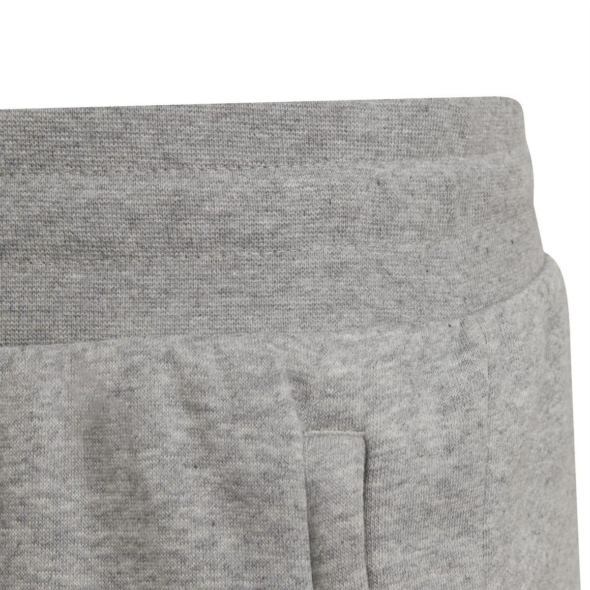 Grey shorts with small side seam panel detail near the hem