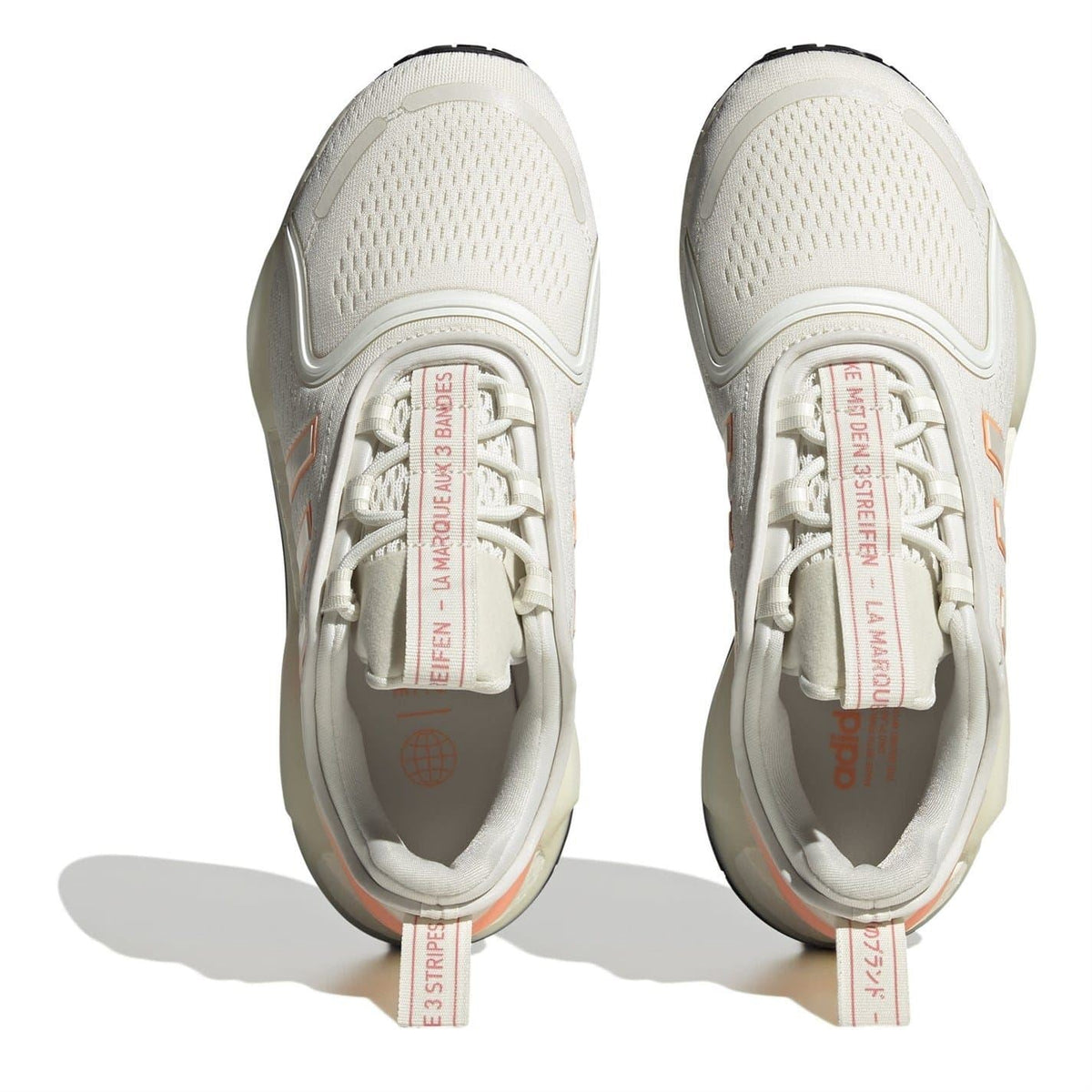 Off-white sneakers with mesh upper and lace tongue label detail, inside view