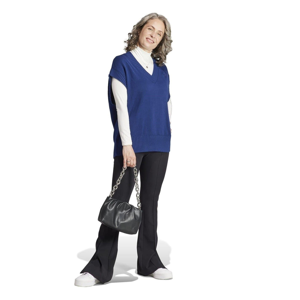 Blue ribbed knit gilet with V-neck and hem ribbing, sleeveless relaxed style