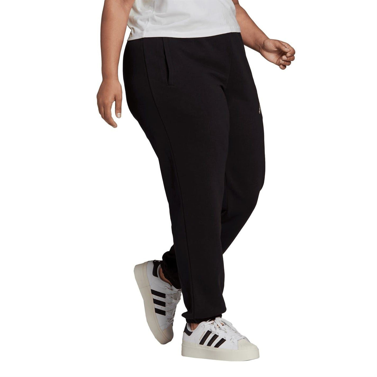 Black track sweatpants with drawstring waist, side seams, and adidas Originals print