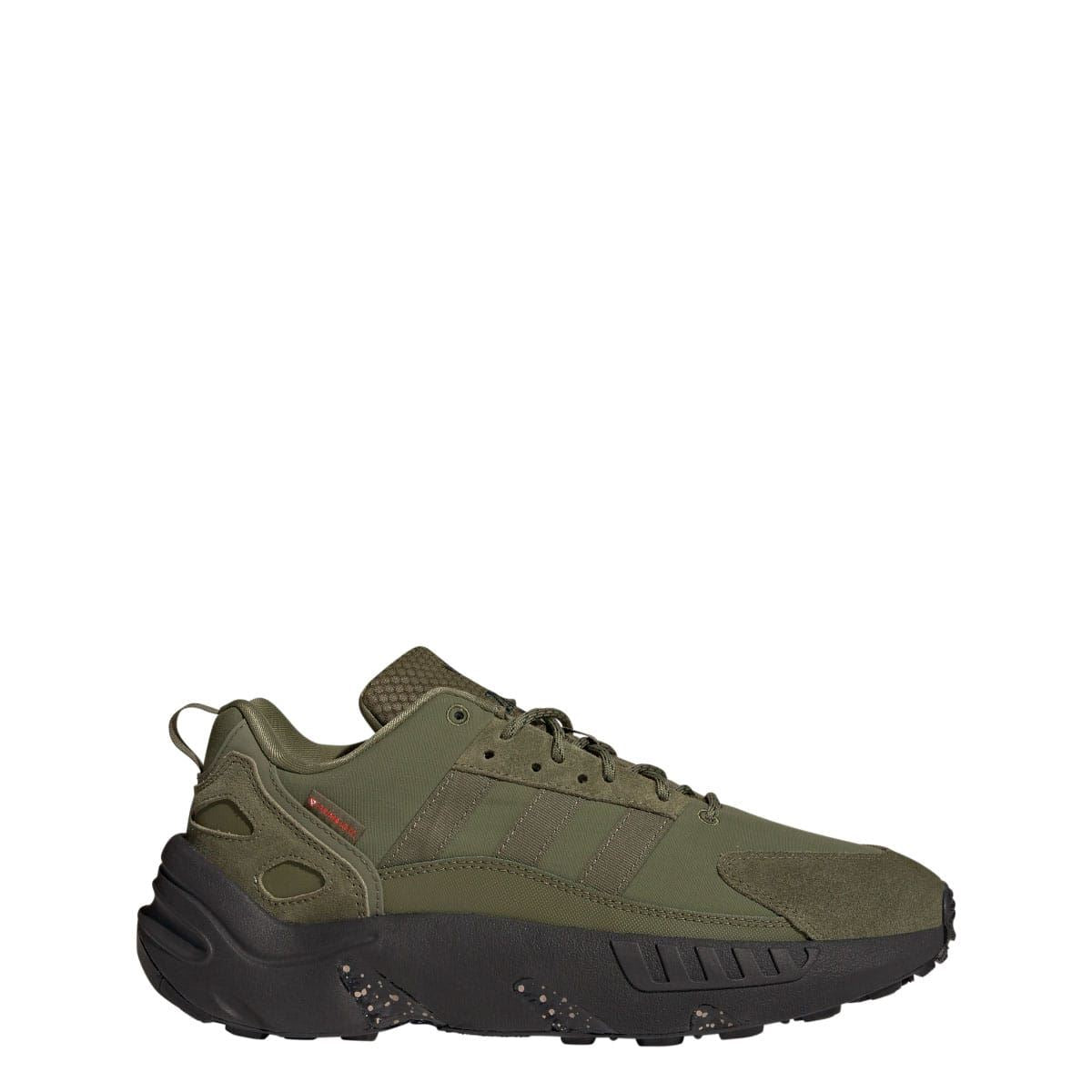 Olive low-top lace-up trainers with textured panels and dark molded midsole