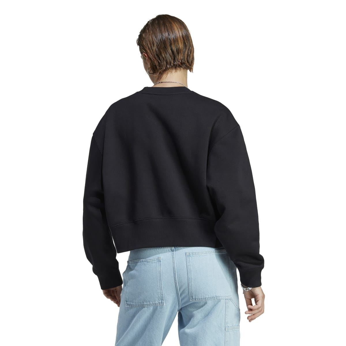 Black crewneck sweatshirt back view with ribbed hem and sleeves