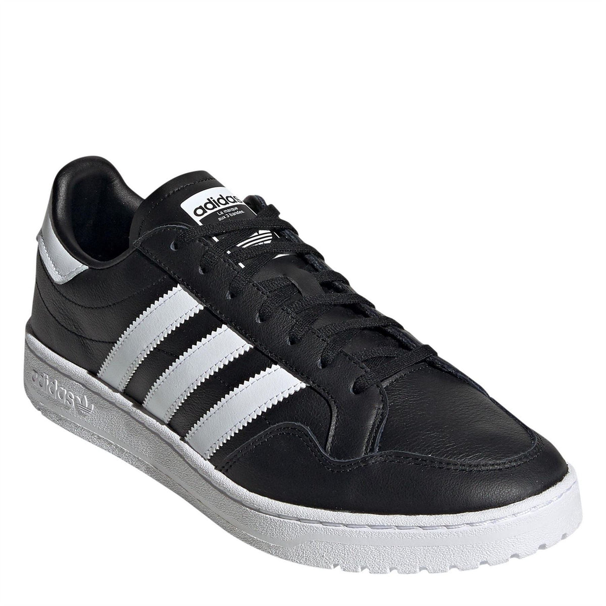 Black leather sneakers with white stripes, lace-up design, and textured rubber sole