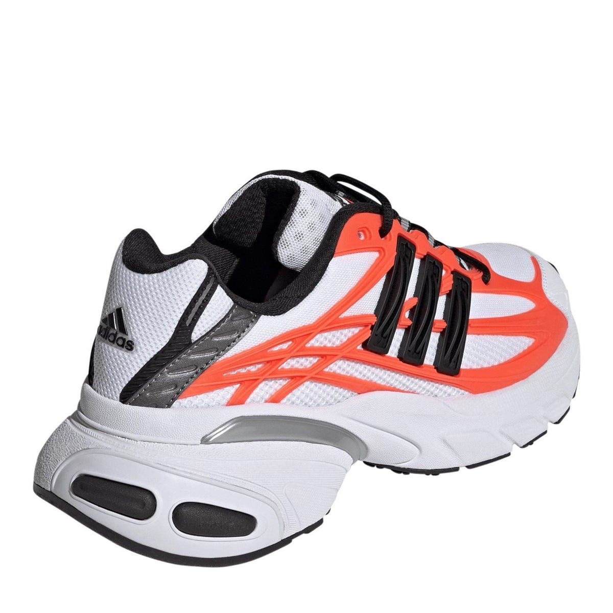 White lace-up sneakers with black heel panel and orange laces, rugged sole