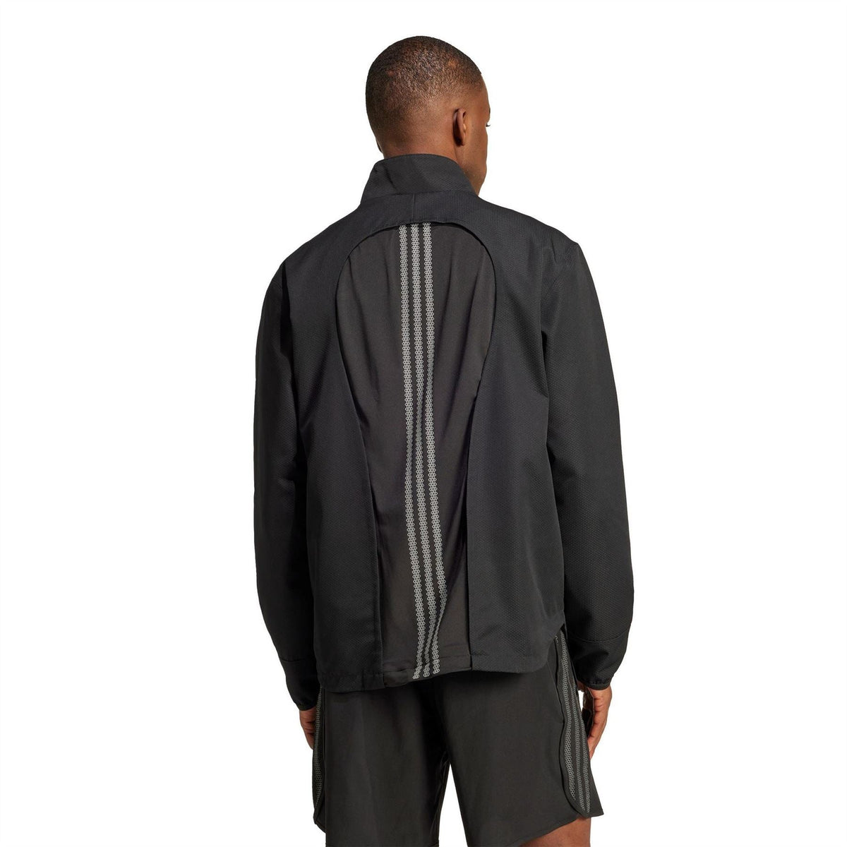 Black hooded windbreaker jacket, back panel with vertical ventilation stripe