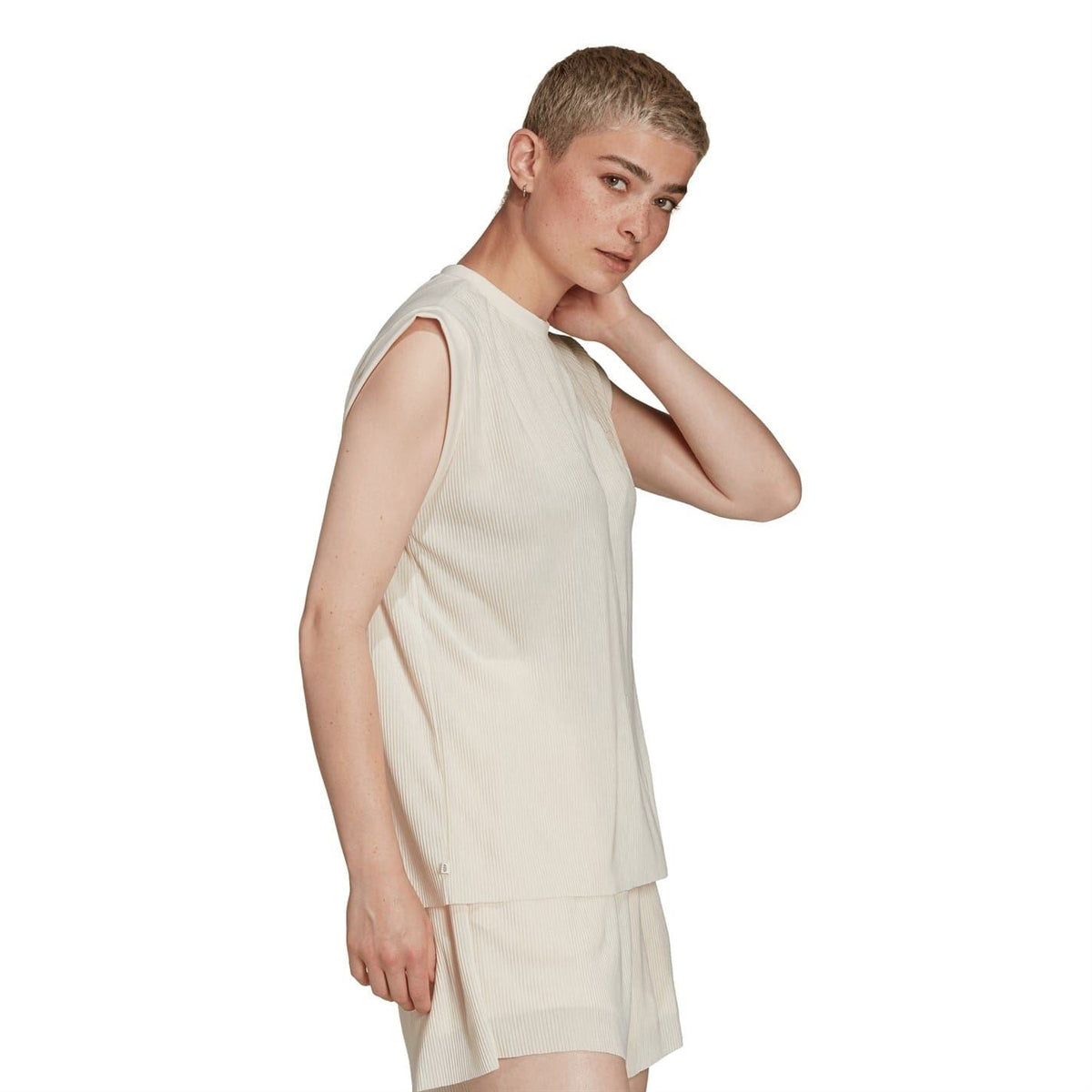 Cream sleeveless crew-neck relaxed-fit tank top with draped hem
